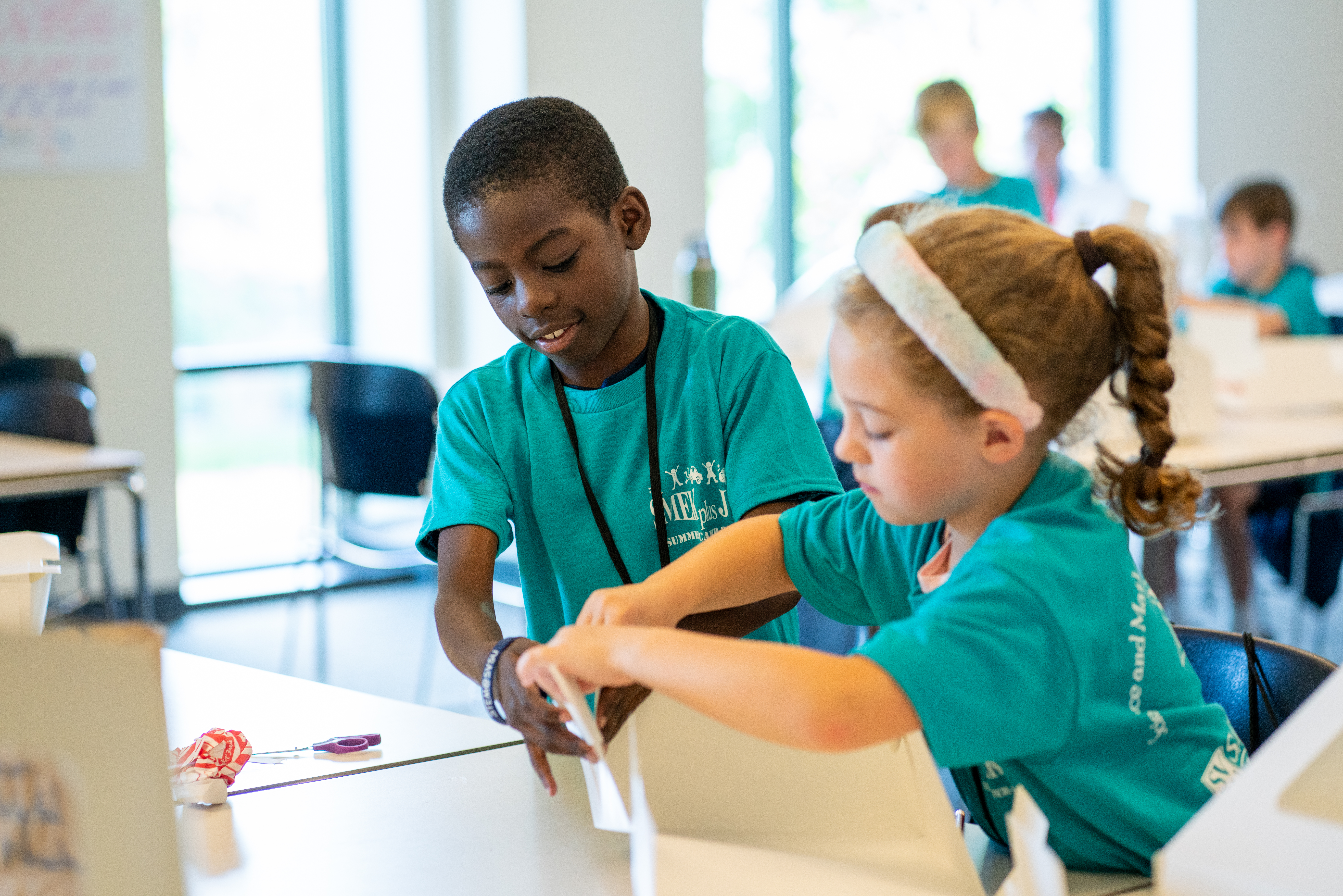Two students building together